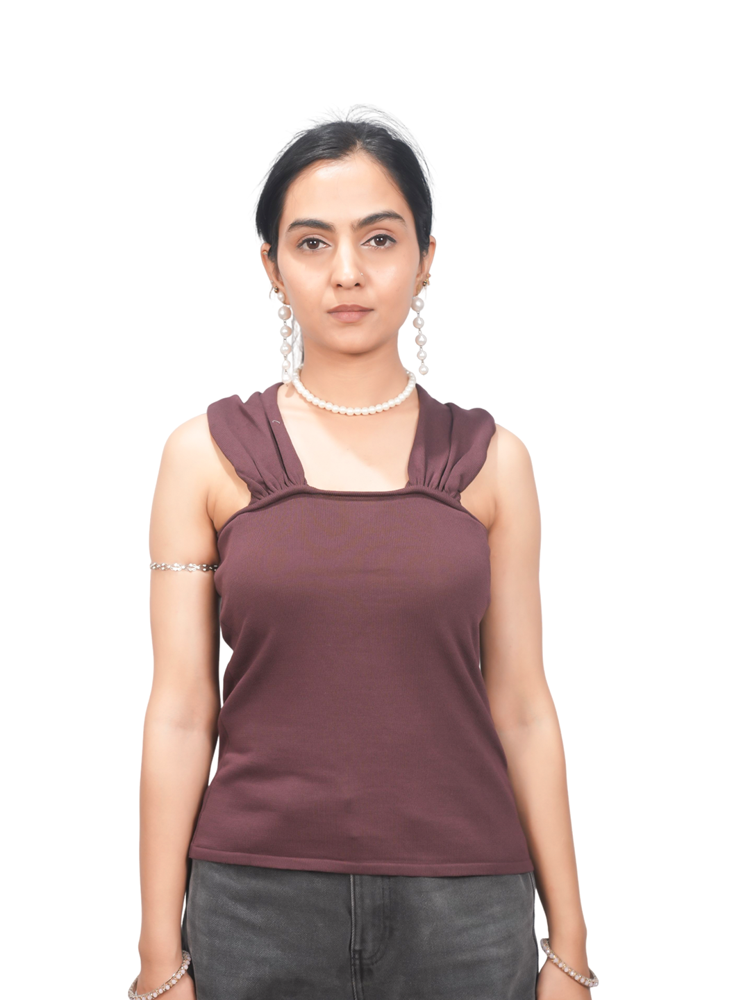 Woman wearing a brown sleeveless top